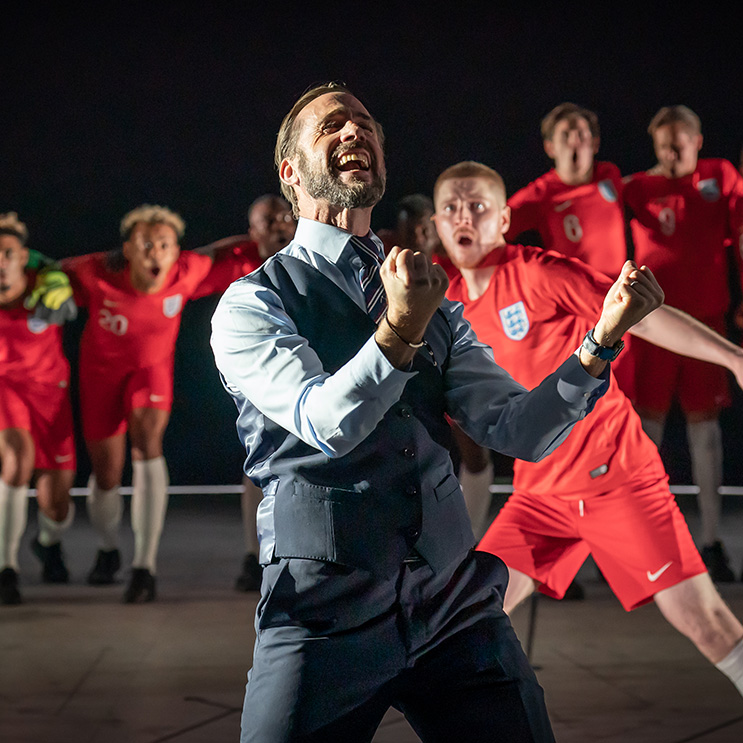 Screenshot of play- dramatic men in soccer jerseys 